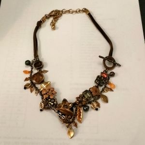 Metal floral necklace with leather straps